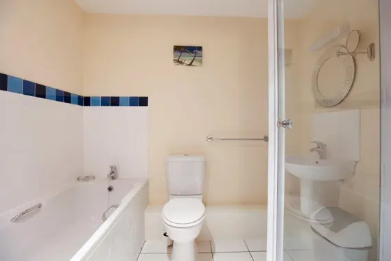 A clean, light bathroom