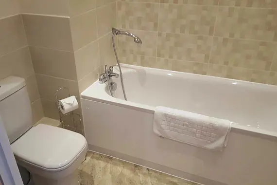 The shower over bath option.