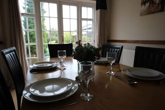 Dining area with doors leading outside