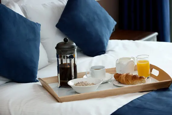 Relax with breakfast in the comfy double beds at The Spires Glasgow