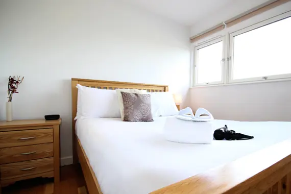 A bright double bedroom in a one bedroom apartment