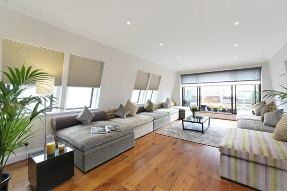 A spacious and charming living room in a four bedroom penthouse
