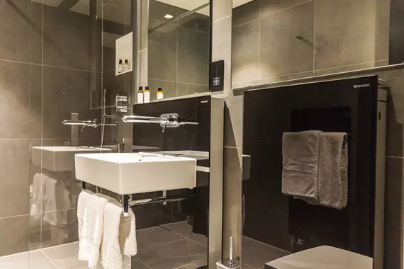 A gorgeous polished bathroom in a one bedroom apartment