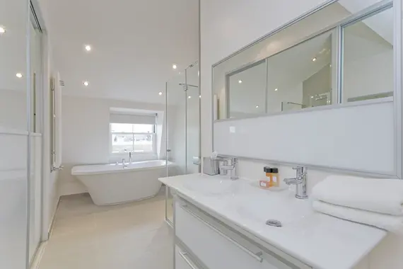 A bright and clean bathroom in the Penthouse Suite