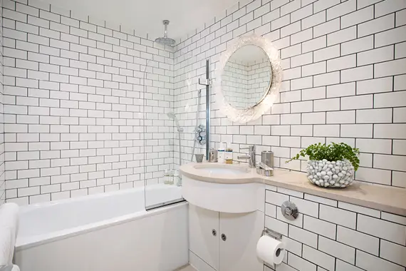 A stunning well light tiled bathroom in the two bedroom loft suite