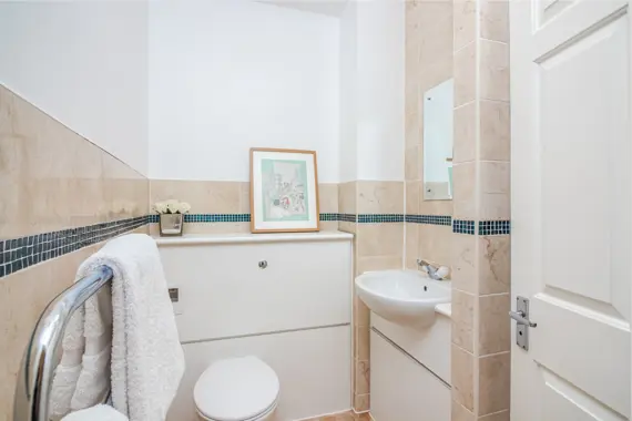 A modern and polished bathroom in Priory House
