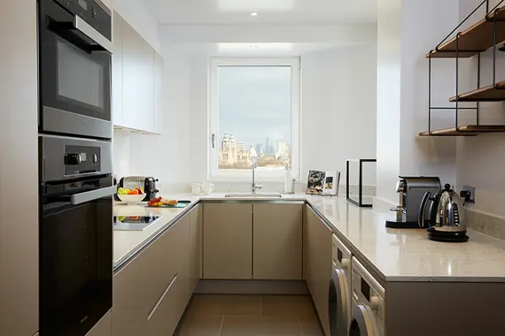 A fully equipped kitchen in a spacious Three Bedroom Apartment