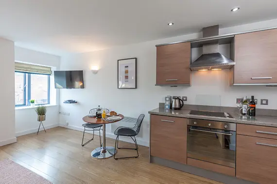 A fully equipped kitchen in the one bedroom standard units