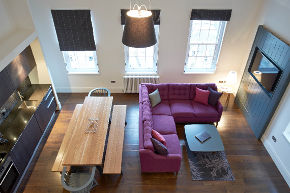 A beautiful and spacious lounge area with an open plan kitchen
