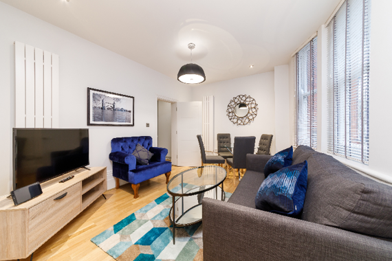 A bright and comfortable living space at Garrick Mansions