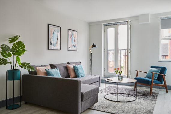 A relaxing and comfortable living room with juliette window/balcony