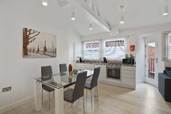 A spacious and splendid kitchen with a dining table for 4