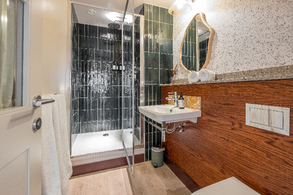 A lounge studio shower room