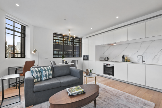 A beautifully furnished open plan living and kitchen area