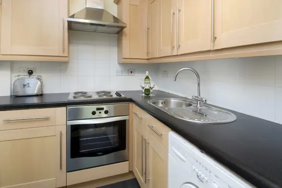 A well equipped kitchen with washing machine