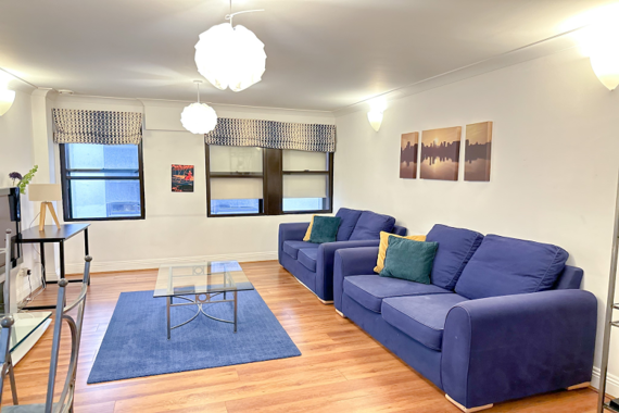 Comfortable and inviting living room, furnished with plush seating for relaxation and entertainment