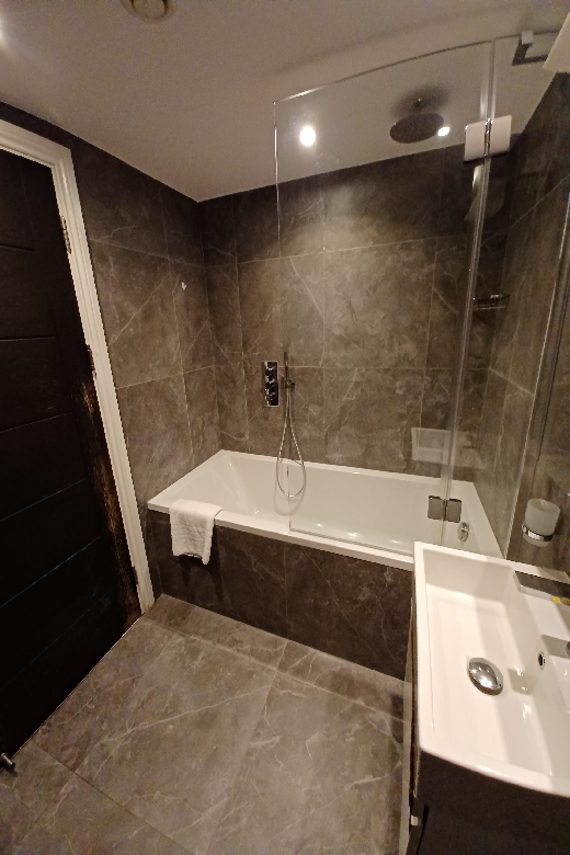 A relaxing shower over bath