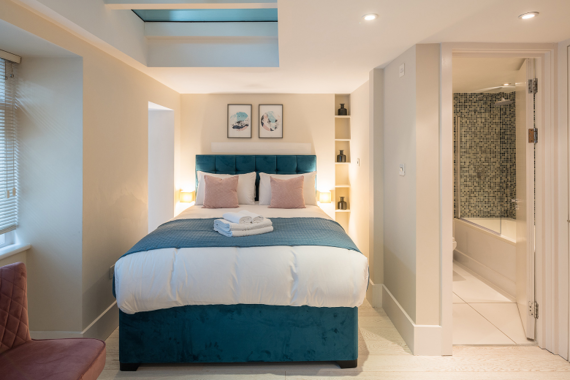 A beautiful and comfortable bedroom with an ensuite