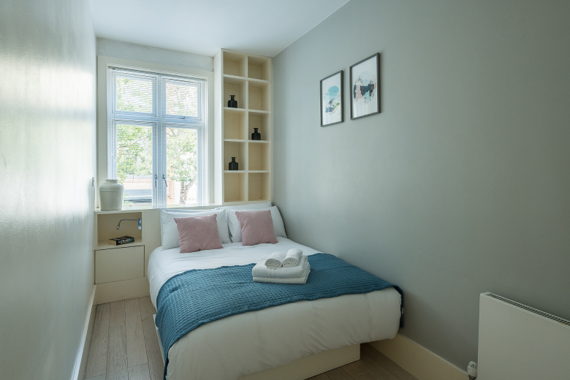 A comfortable and relaxing bedroom in Charlotte Apartments