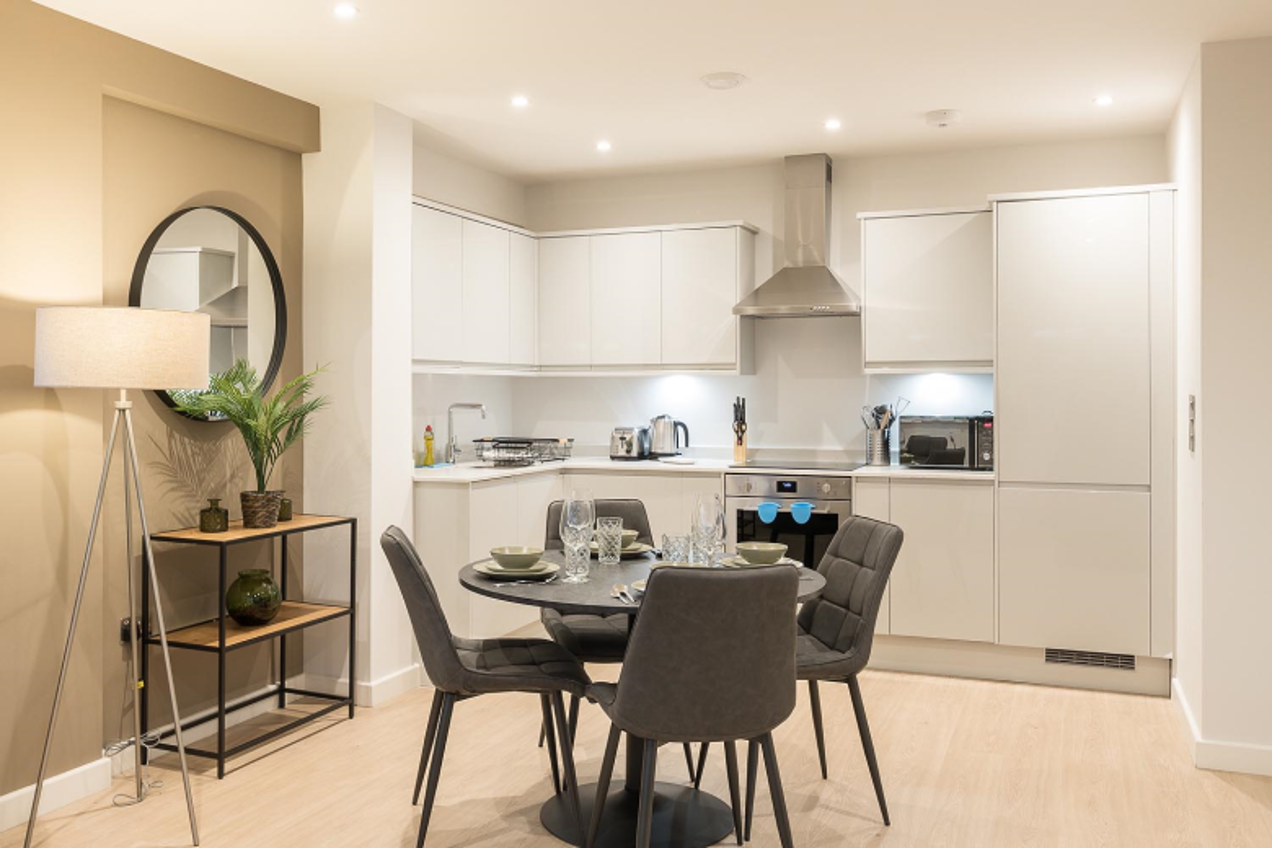 A beautifully furnished open plan kitchen and dining area
