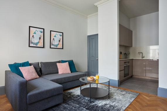 A bright and colourful lounge and open plan kitchen