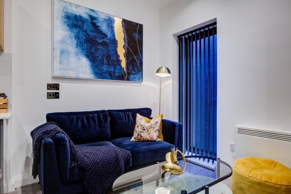 The living room boasts a bold and bright aesthetic