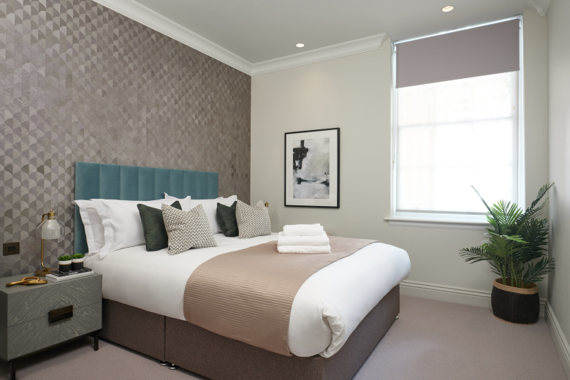 Retreat to a stylish and elegant bedroom, adorned with luxurious touches and a soothing color palette