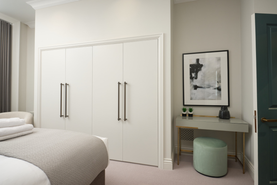 Spacious and well-appointed bedroom, offering ample storage and a peaceful retreat