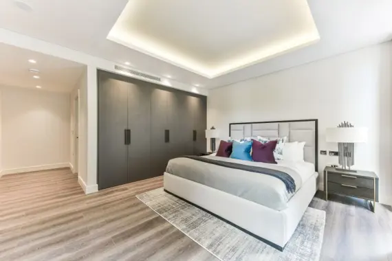 Retreat to a stylish and elegant bedroom, adorned with luxurious touches and a soothing color palette