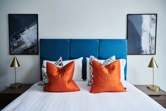 Restful haven featuring luxurious touches and soothing hues