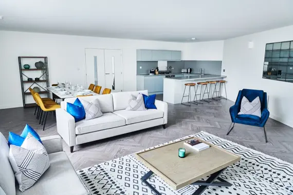 Immerse yourself in a rather spacious and decorative living room, adorned with tasteful accents and eye-catching details