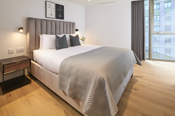 Inviting bedroom oasis with a cozy bed and serene ambiance