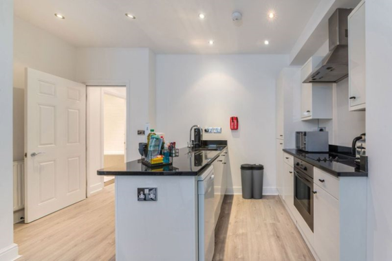 Fully equipped kitchen with modern appliances 