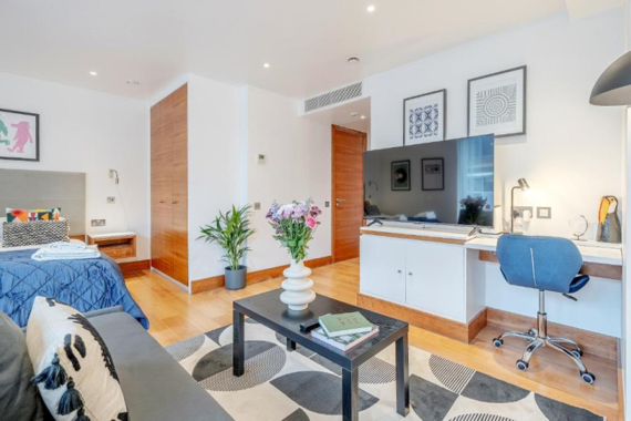 Stylishly decorated open plan bedroom and lounge area