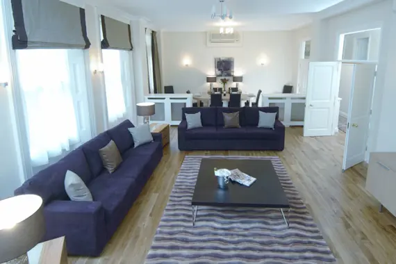 A spacious, light living area in a four bedroom apartment