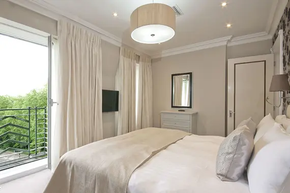 A bright and relaxing bedroom with lovely views at Fountain House