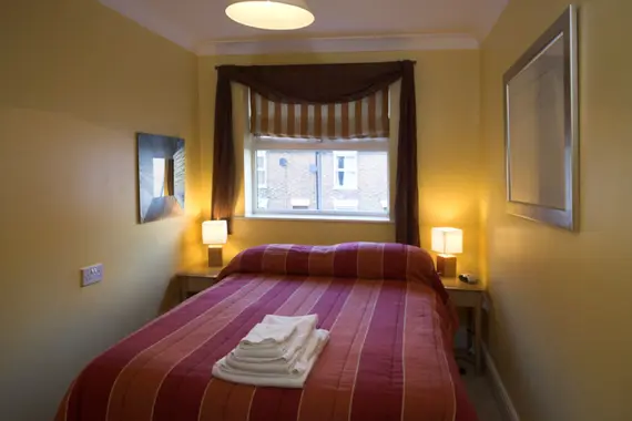 Another cosy bedroom with a comfortable bed