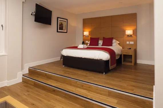 The spacious sleeping area in a studio apartment