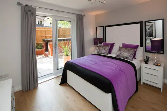 A fabulous bedroom with access to outside space
