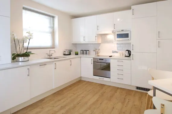 One of the bright, sleek kitchens