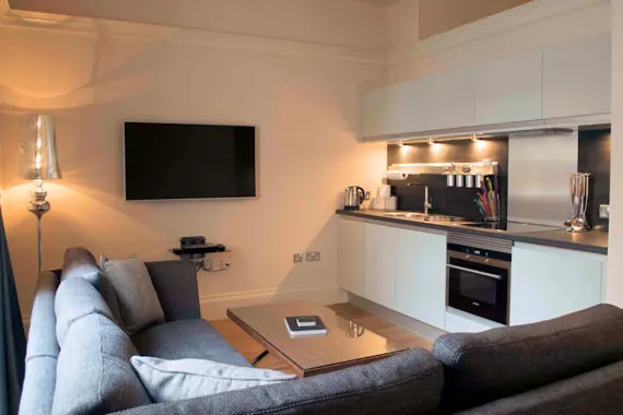 A sleek, modern kitchen and comfortable living area