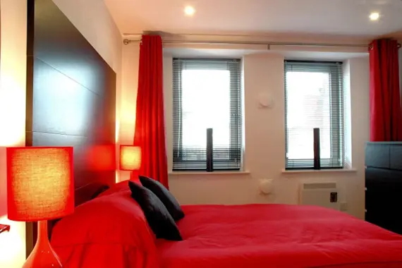 A cosy double bedroom in a typical one bedroom apartment