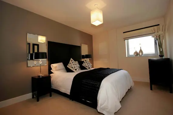 A spacious double bedroom in a typical two bedroom apartment