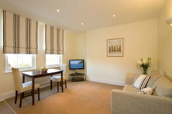 A spacious, cosy living area at Castle Crescent Apartments