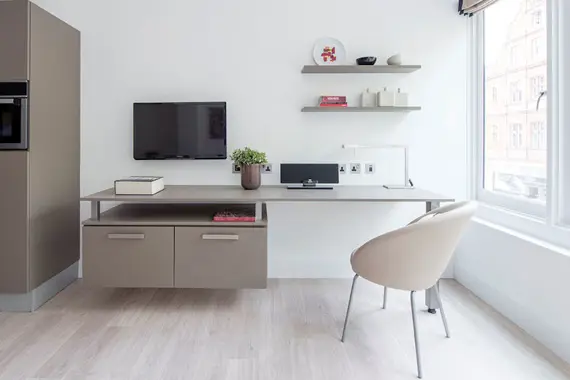 The modern TV and study area in a premier one bedroom apartment