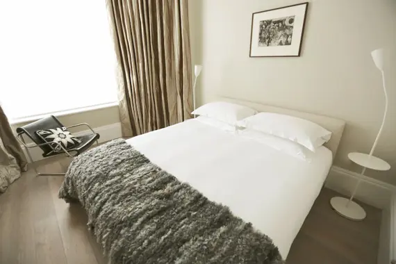 A sleek bedroom at 56 Welbeck Street