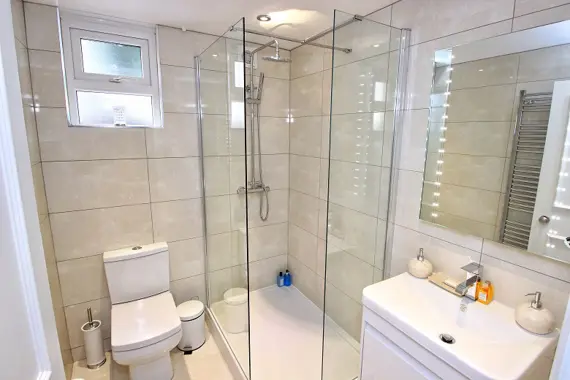 The Garden Suite bathroom is fitted with a beautiful large walk-in shower
