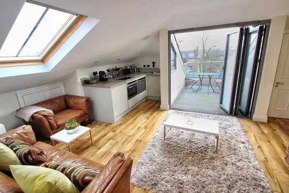 A luxury rental studio loft apartment in Twickenham with a large terrace offering amazing views of Richmond Hill