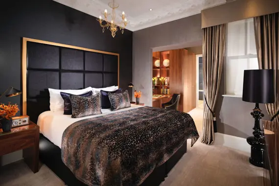 A sumptuous one bed suite bedroom at Flemings