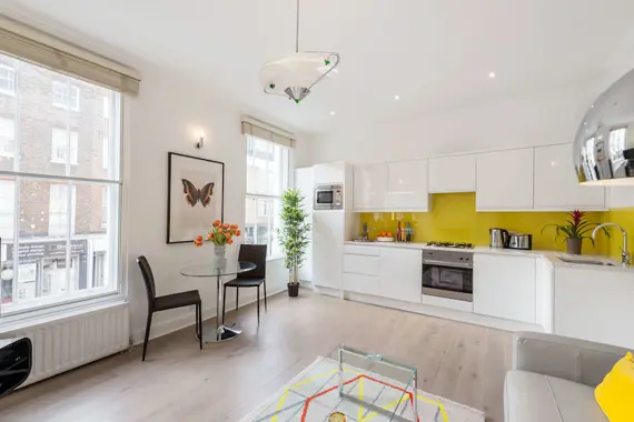 An open plan living area with fully equipped kitchen